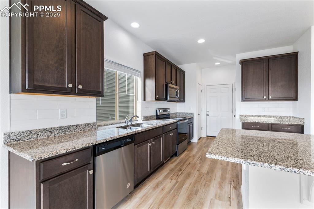 Tons of cabinets and a pantry in the kitchen