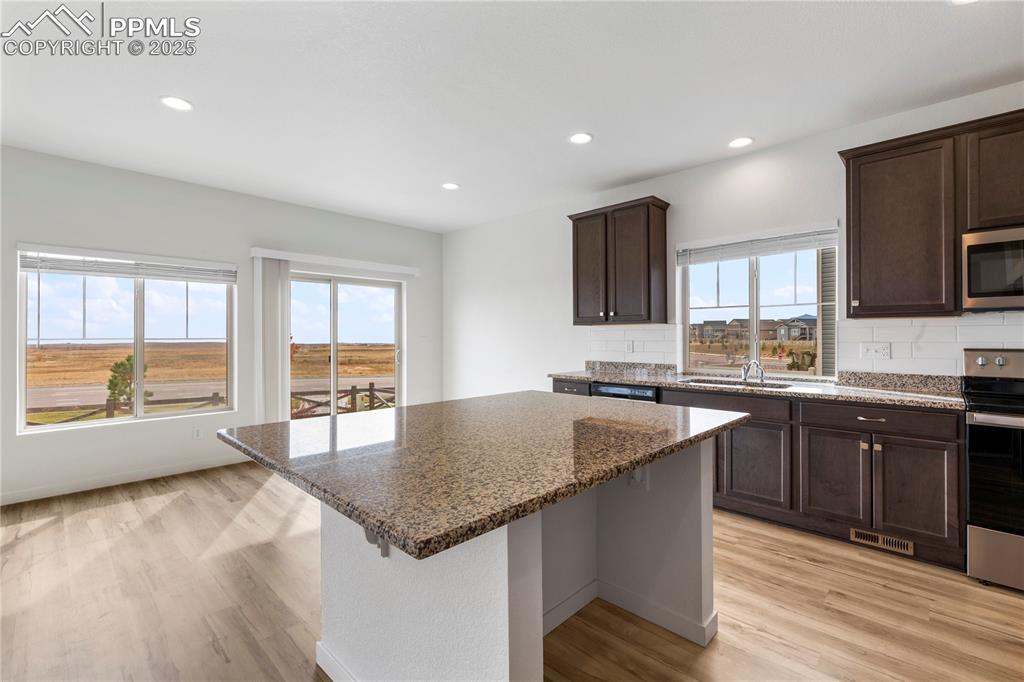 Giant island with solid slab granite counter tops