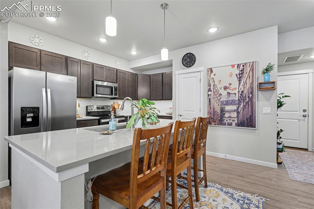 Under cabinet lighting with warmth and function to the kitchen.