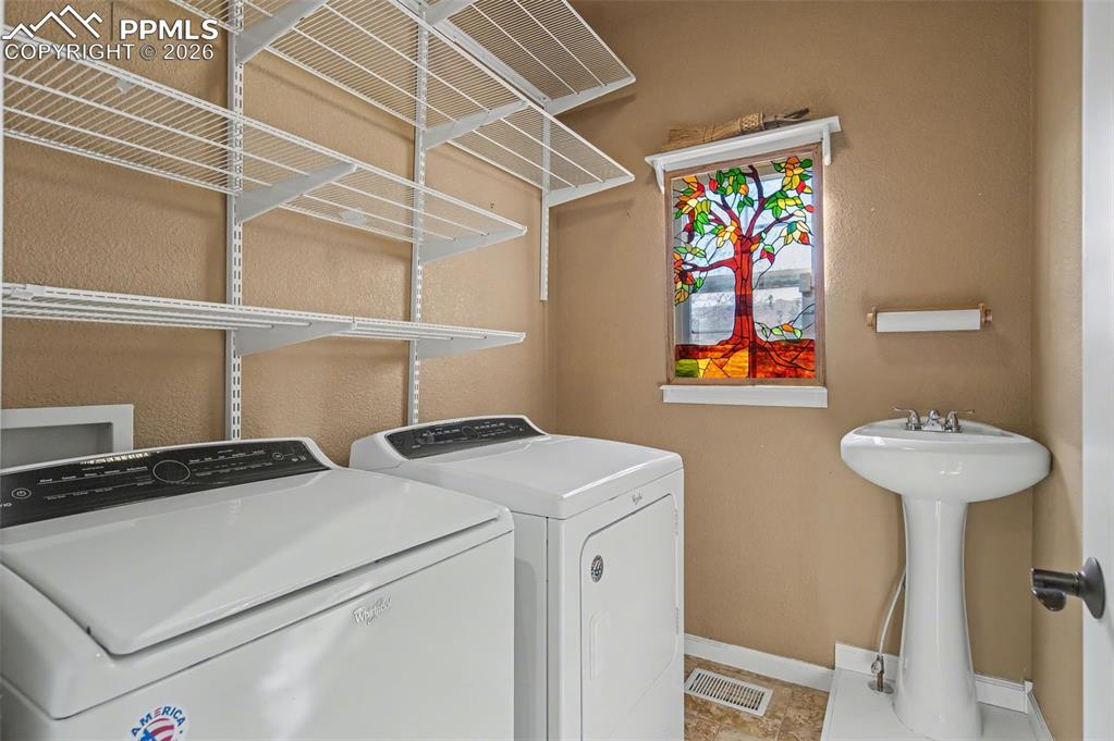 Convenient Main Level Laundry Room with Sink!