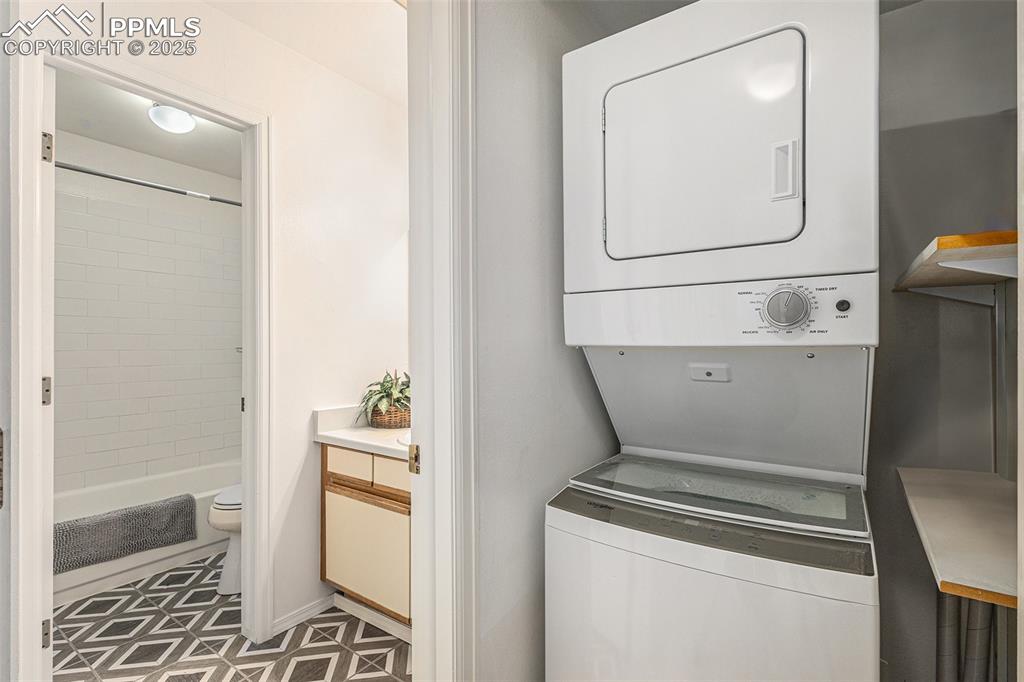 Convenient stackable washer/dryer off of bathroom