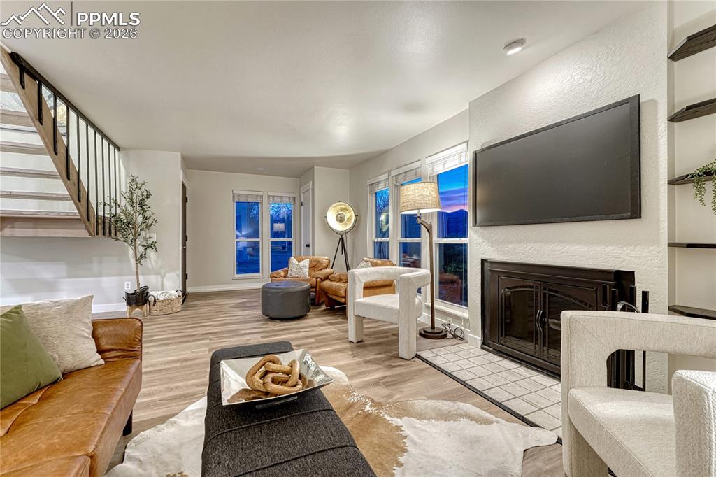 A cozy woodburning fireplace in the Living Room