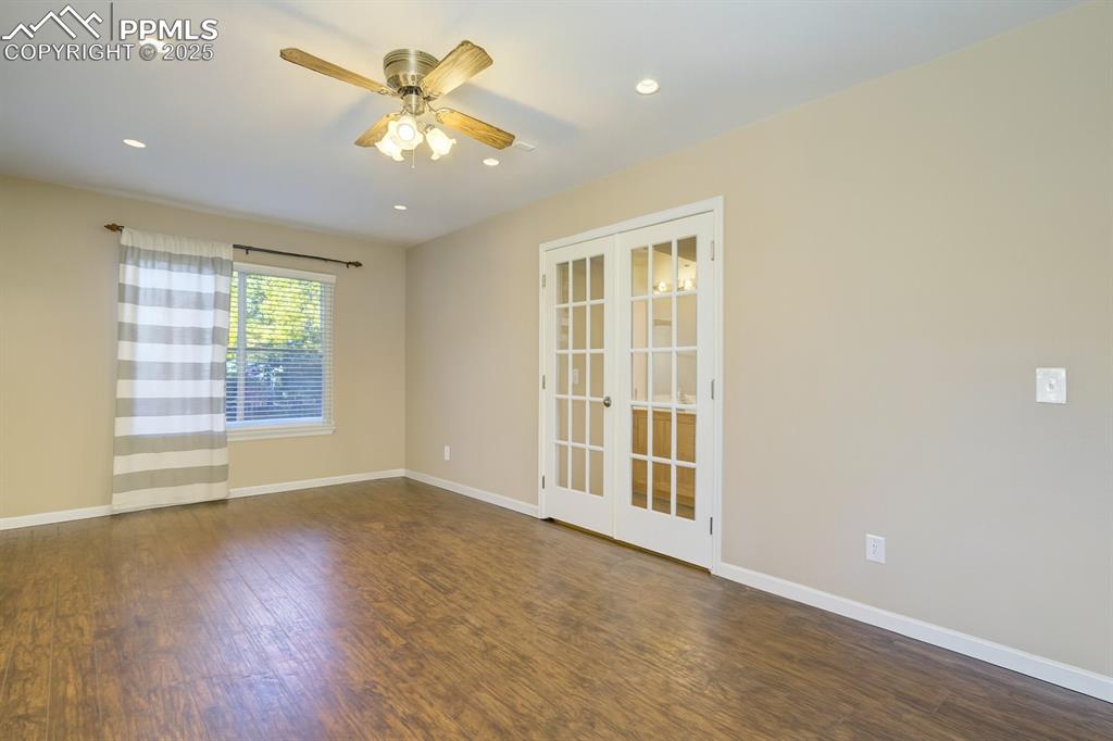 Spare room with french doors, dark wood-style flooring, recessed lighting, and ceiling fan