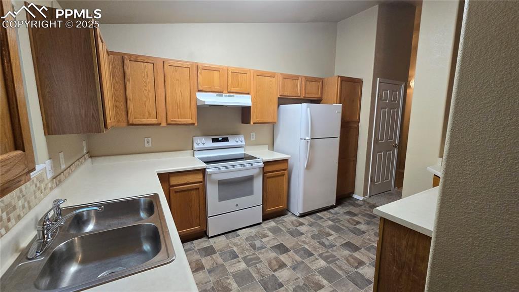Brand new flooring and oven in kitchen