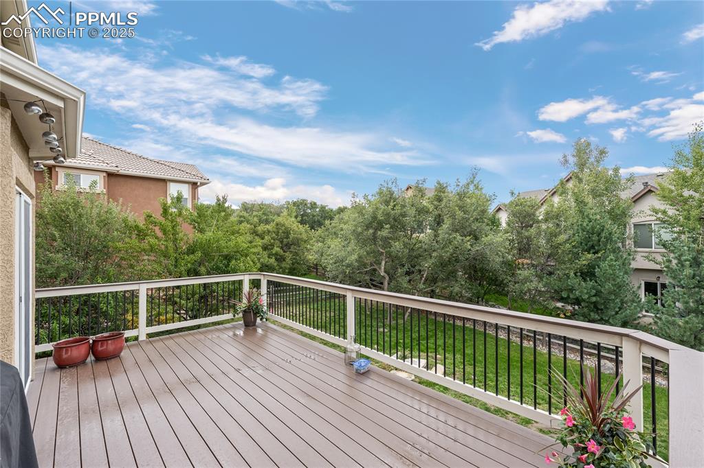 Deck with view of treed area