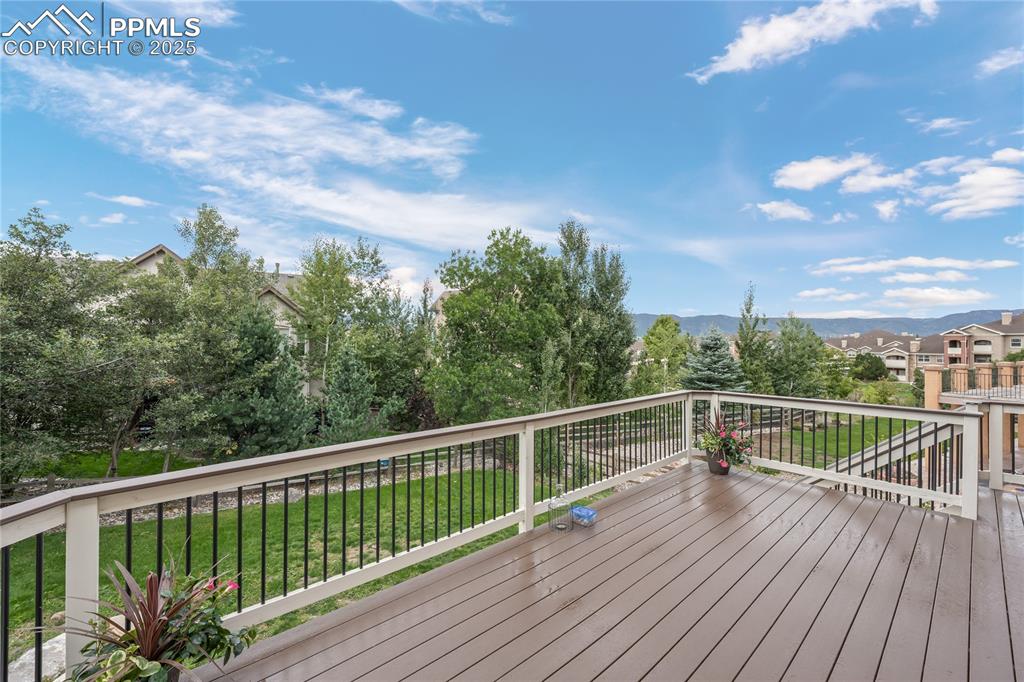 Deck featuring a view of the lawn and a mountain view