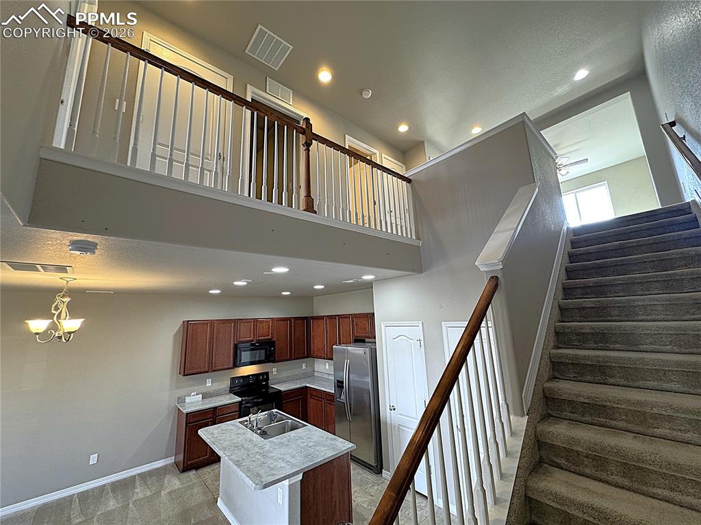 Open Staircase with See-thru railings with Upper & Lower Spindle Railings