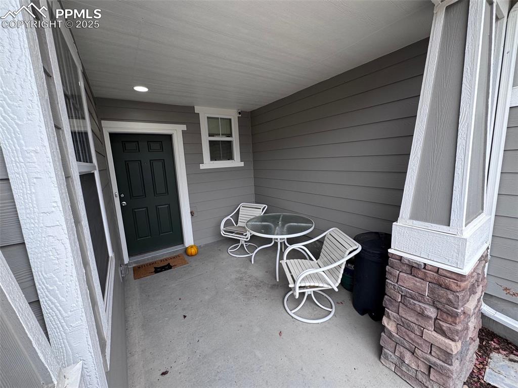 Doorway to Home Featuring a Covered Porch