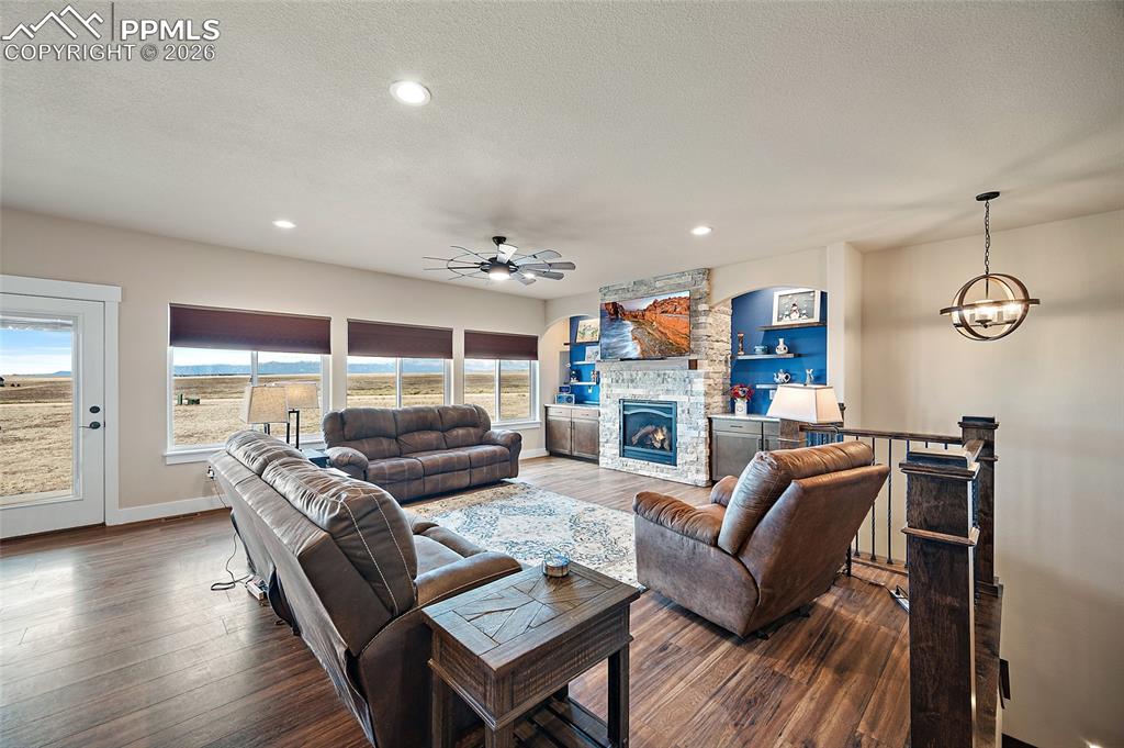 Spacious living room with gas fireplace and mountain views.