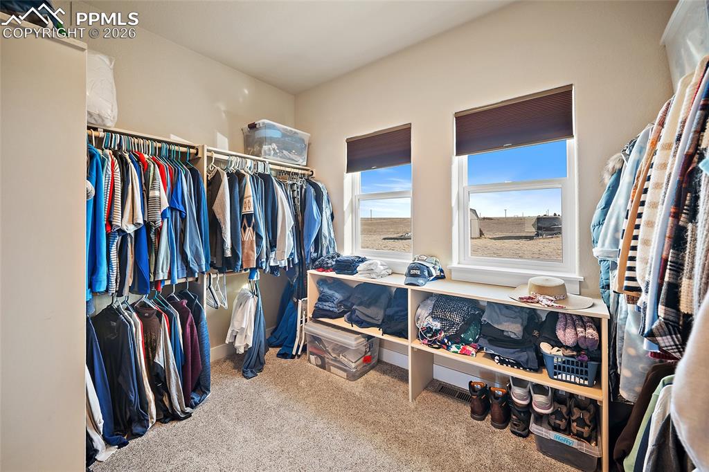 Walk in primary closet.