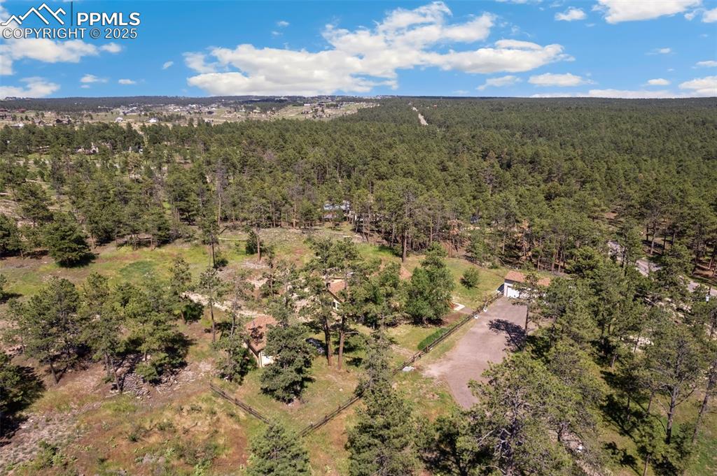 Facing SE, showing driveway and front fencing
