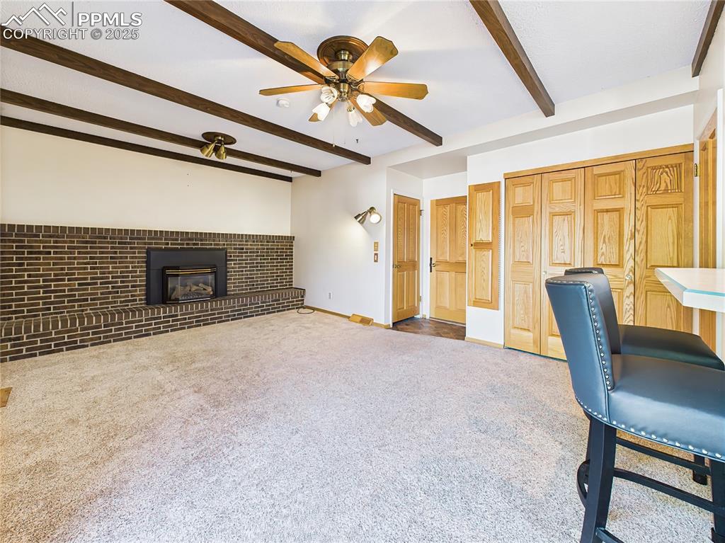Family Room (Unfurnished, Alternate View) – Highlighting the home’s gas fireplace with a full brick hearth, this family room invites cozy evenings and offers great flow to the heart of the home.