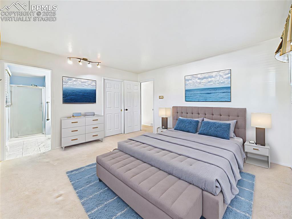 Virtually Staged Primary Bedroom with En-Suite emphasize layout and comfort, this primary suite includes walk-in closet, soft carpet, and private bathroom access.