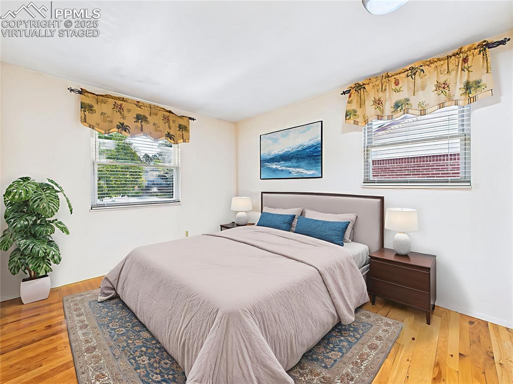 Virtually Staged Bedroom 3 This bedroom includes double-door closets and fresh wall color, beautifully staged to show off the generous space and functionality.