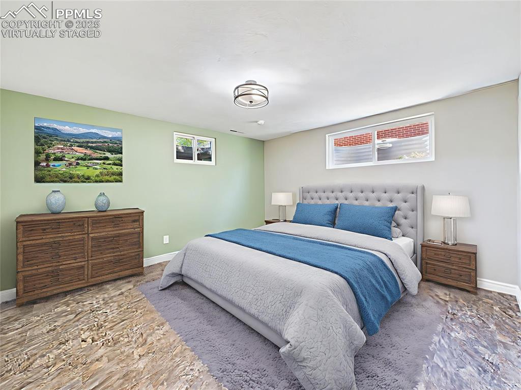 Virtually Staged Basement Bedroom this spacious lower-level bedroom boasts fresh paint, natural light from egress windows, and newer luxury flooring (2023).