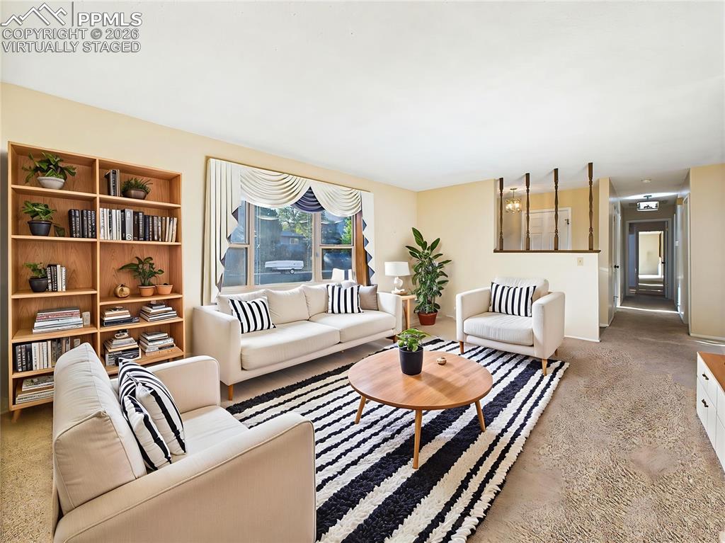 Virtually Staged Living Room layout demonstrates how this expansive living space can be beautifully arranged with built-in bookshelves and media area.