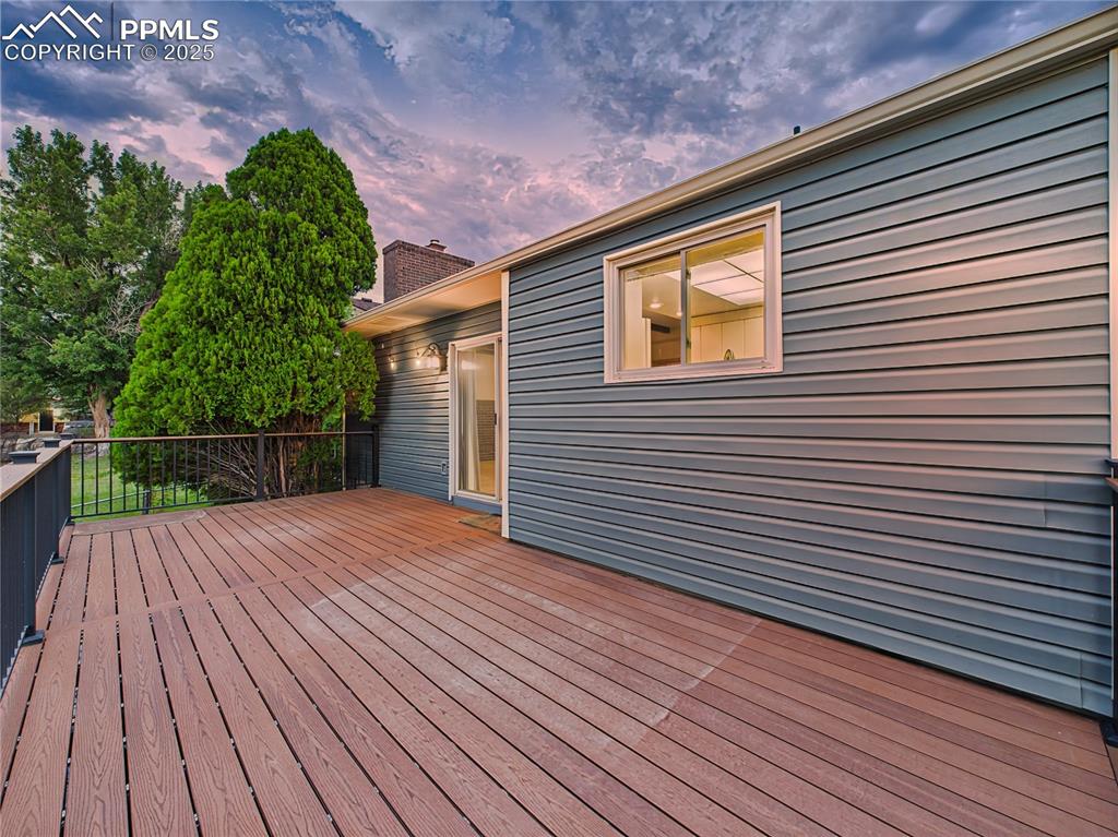 Wide Trex Deck (Unfurnished) – The generous footprint of the back deck allows for multiple outdoor zones with easy access through sliding glass doors from the family room.