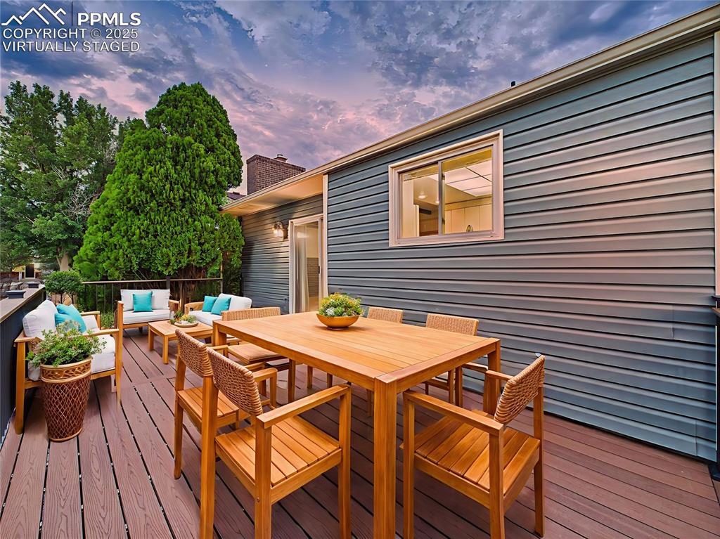 Trex Deck (Virtually Staged) – Virtually staged to showcase its potential, this outdoor living space is ideal for hosting, dining, or simply enjoying Pikes Peak views at sunset.