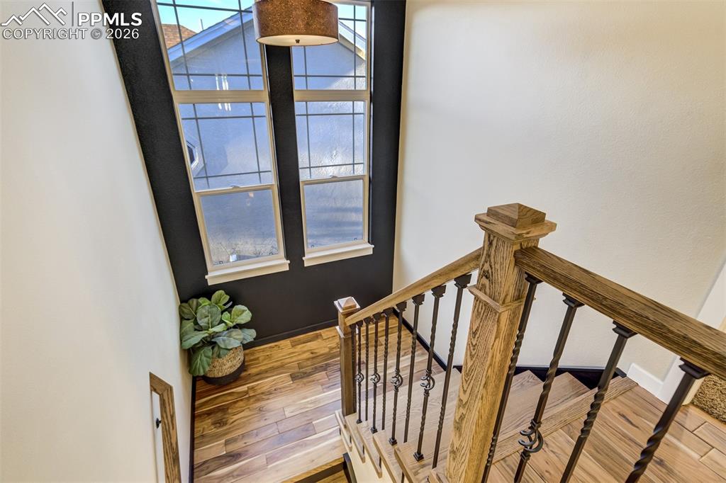 Gorgeous acacia flooring continues up the stairs to upper level