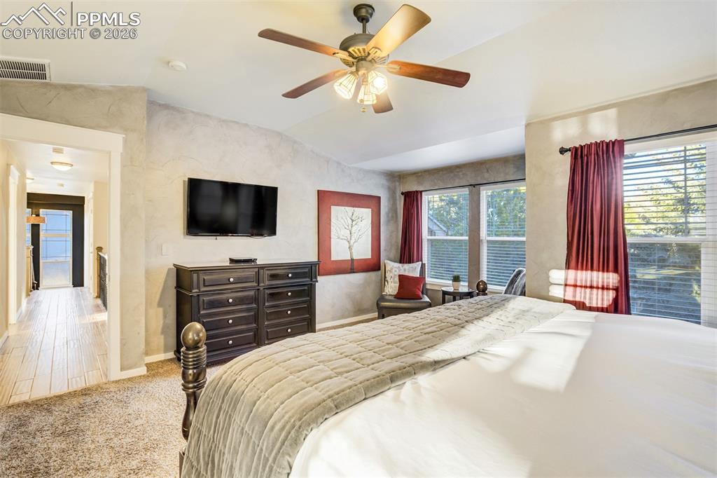 The primary suite is located down the hall from the additional 3 upper level bedrooms