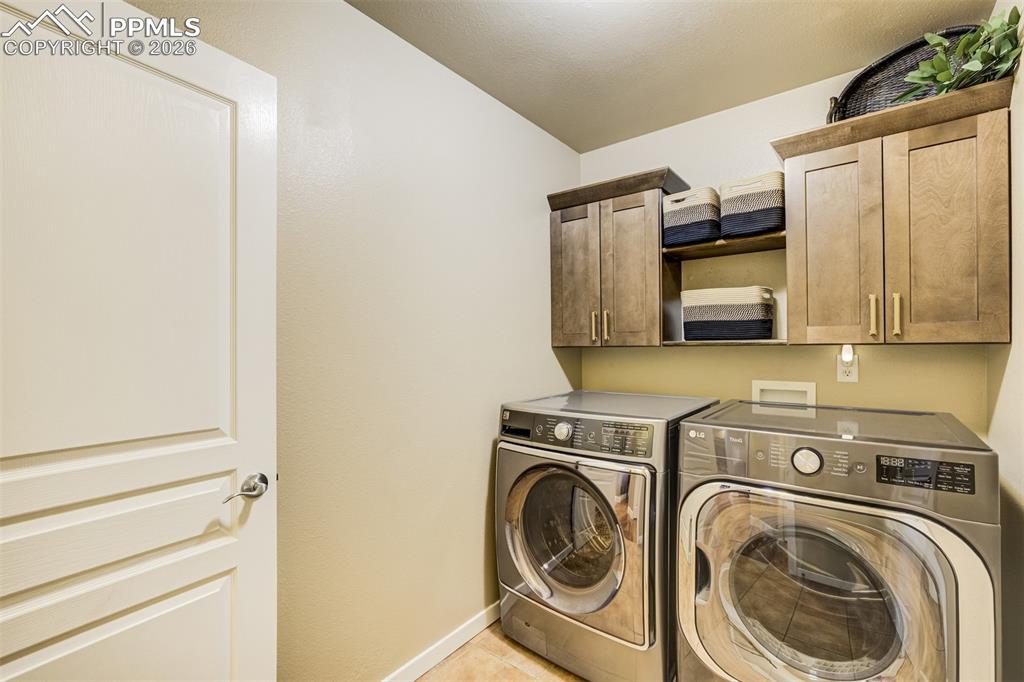 Main level laundry with cabinetry