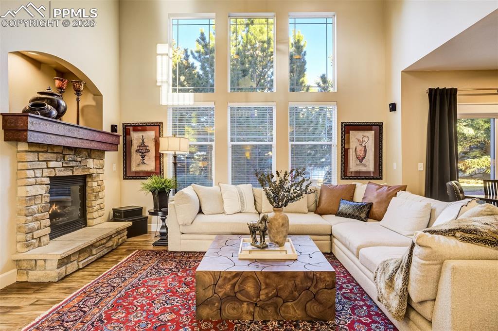 The stunning custom fireplace is the focal point of the family room