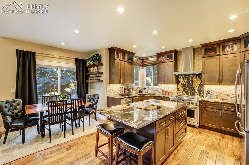 With a large center island offering seating and a cozy eat-in nook, the kitchen is the perfect gathering place!
