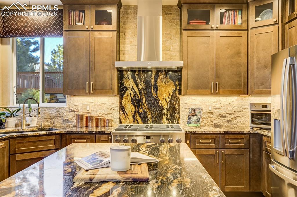 Elevated kitchen with granite and tile is stunning!