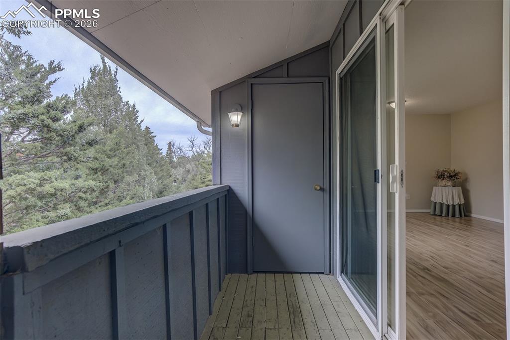 Balcony off the living room with trees to enjoy.