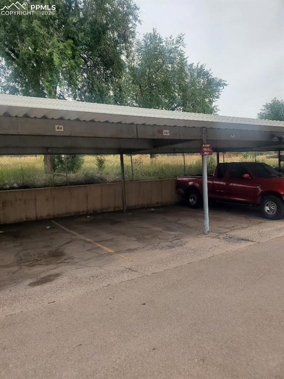 Parking space in carport, close to front door of the unit.