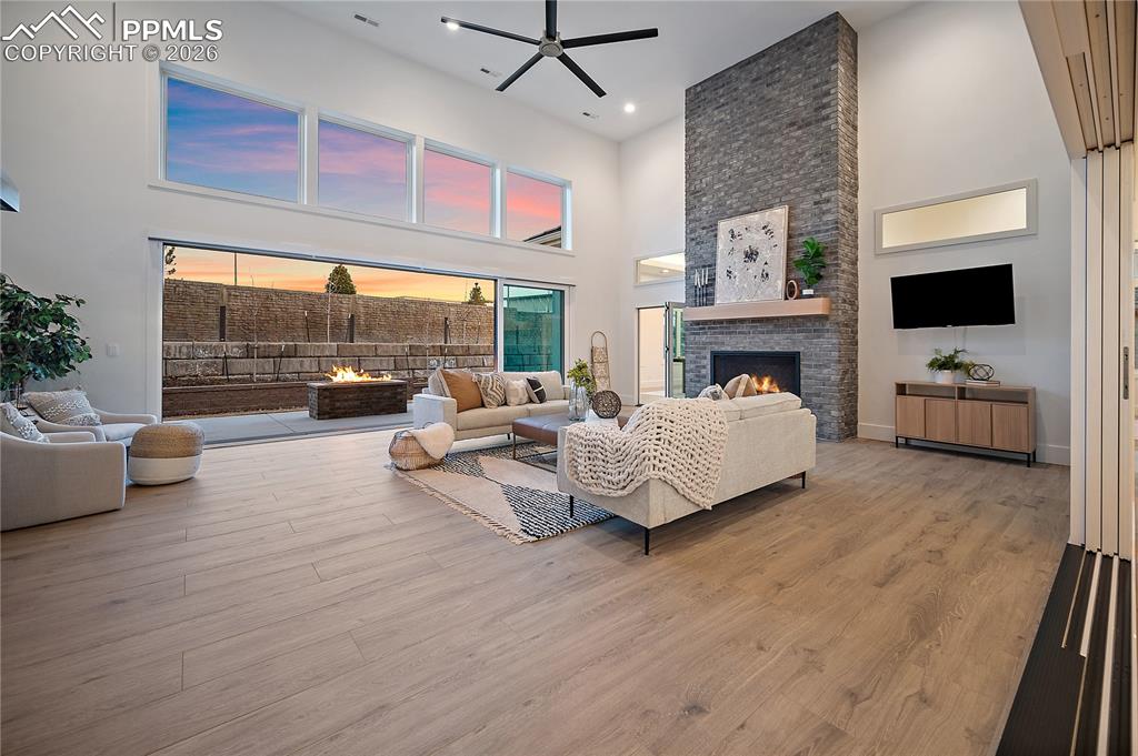 A fully insulated indoor-outdoor living space designed for year-round comfort, with heating and cooling for every season. Expansive sliders open completely to the outdoors or close to create a cozy indoor retreat, complete with a gas fireplace and infrared grill for all-season enjoyment.