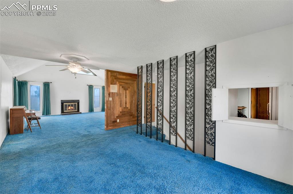 dining room looking into the living room. stairs to the basement are on the right. Passthrough to the kitchen