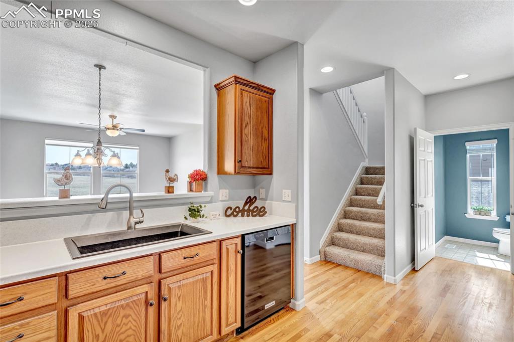 Remodeled kitchen with Corian countertops, new sink, and stainless steel appliances