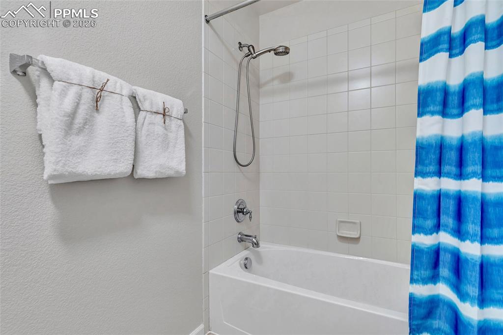 Full bath on second level with separate bathing and changing area