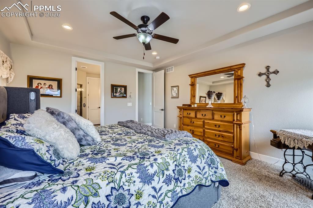Bedroom with carpet floors, recessed lighting, a ceiling fan, and baseboards