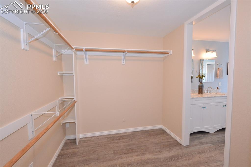 Large maser bedroom closet  with entry to master bathroom.