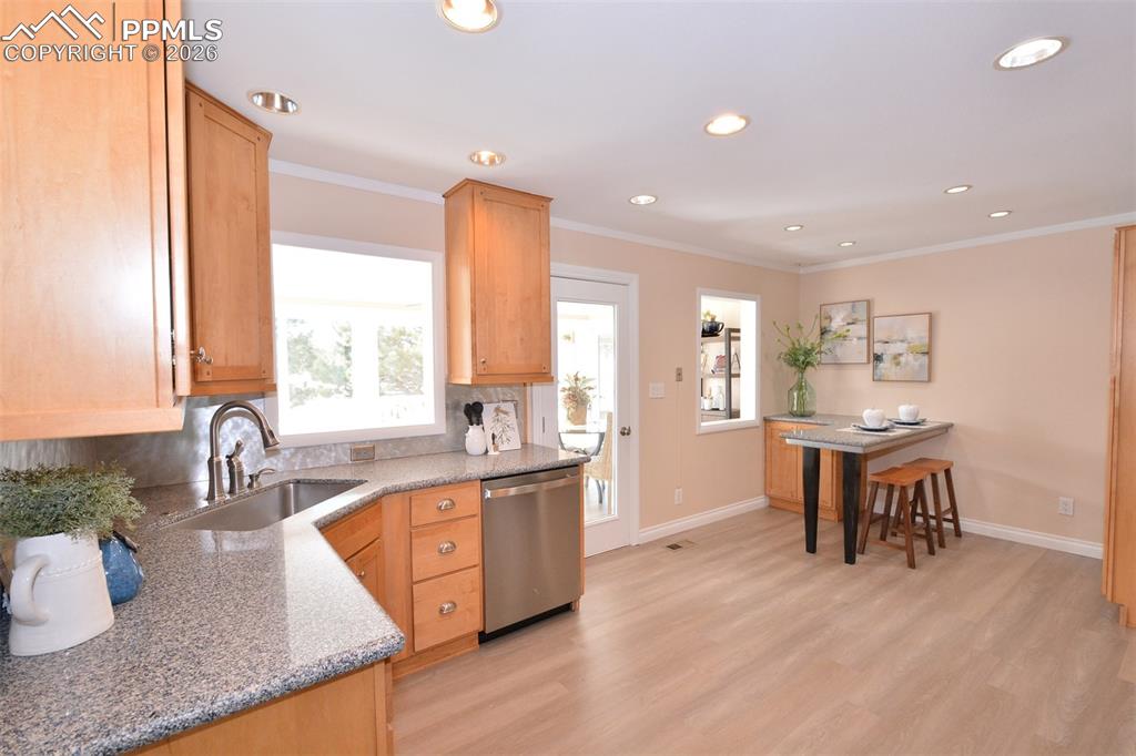 Kitchen with plenty of cabinets, stainless appliances and breakfast nook.