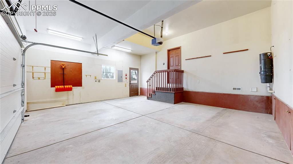 Garage with a central vacuum unit