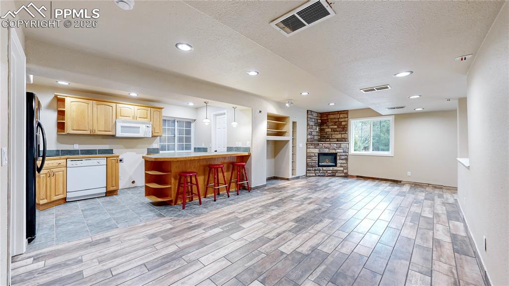 View from basement recreation room to kitchenette