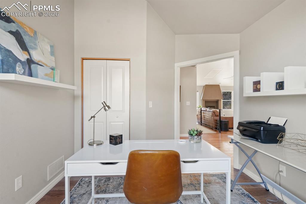 Home office featuring hardwood / wood-style flooring