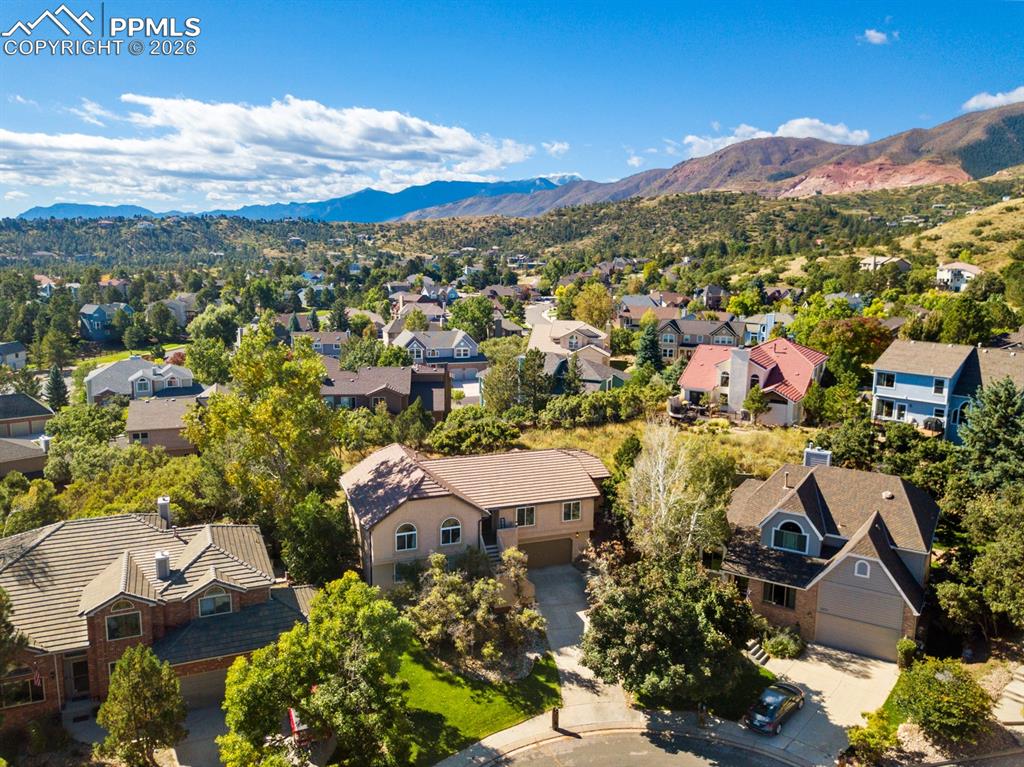 Birds eye view of property with a mountain view