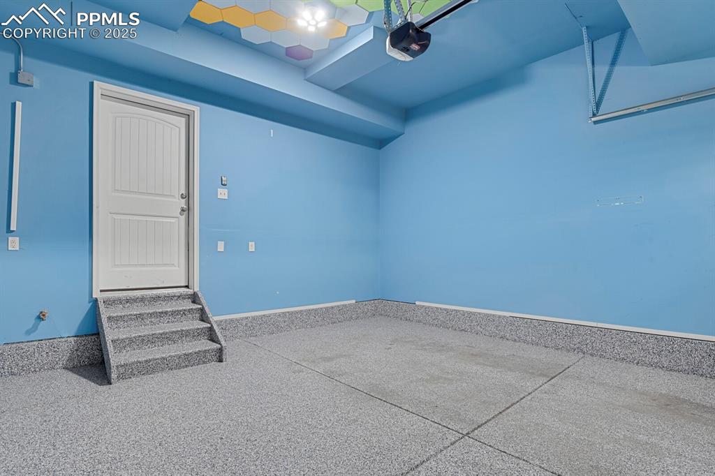 Garage featuring epoxy flooring.