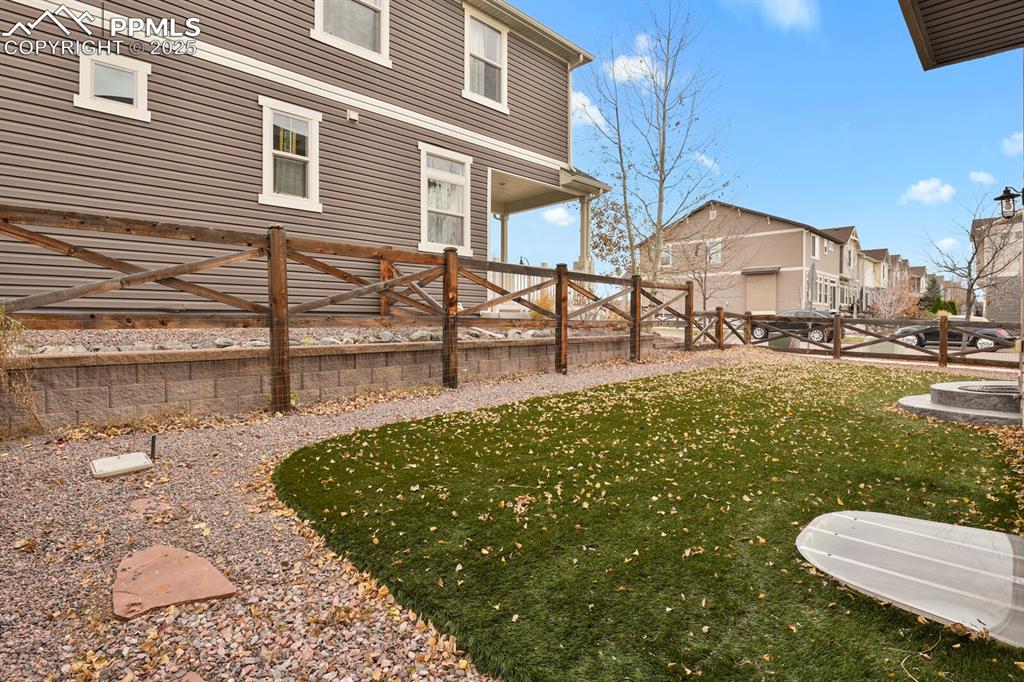 
Backyard featuring stampled concrete and pet friendly artificial turf.