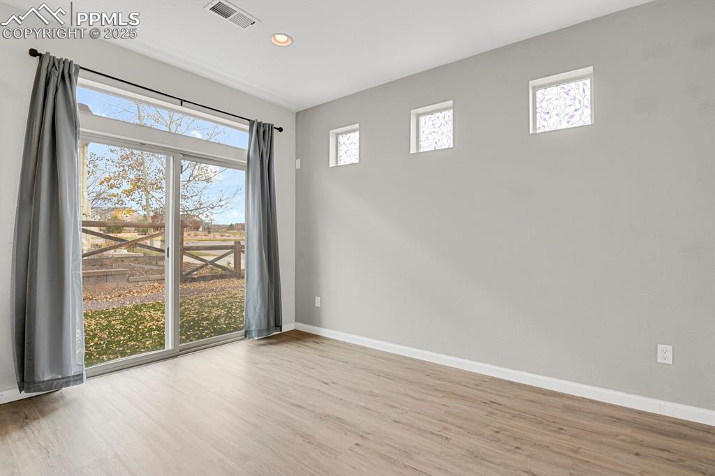 Spare room featuring light wood-style floors and recessed lighting