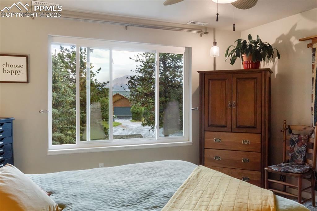 View of Pikes Peak out the primary bedroom window (photo taken during rainstorm)
