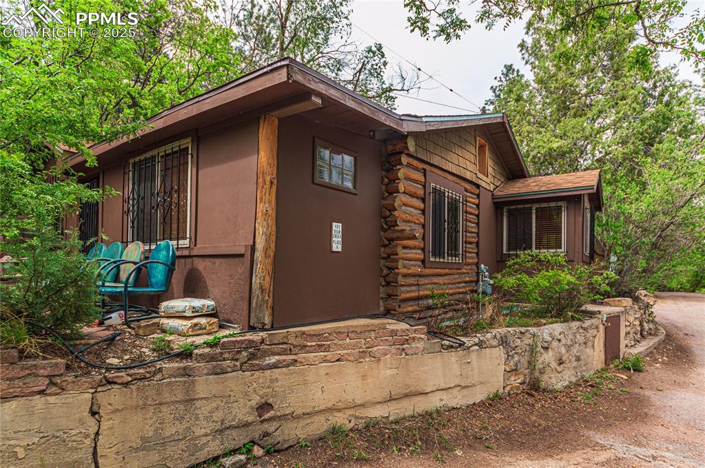 View of property exterior with log exterior