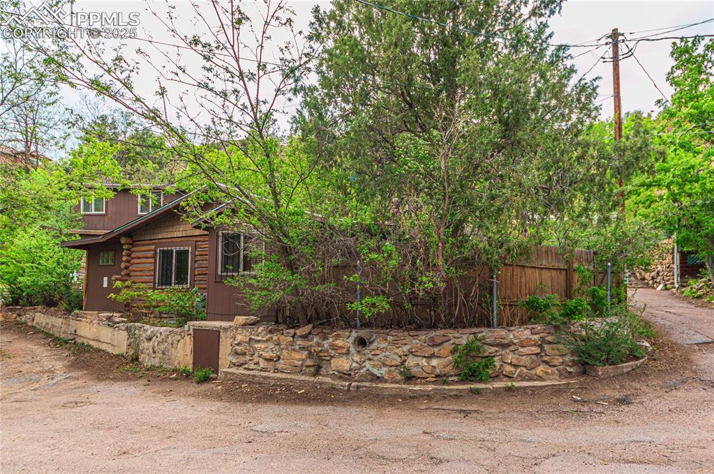 View of property exterior featuring log exterior