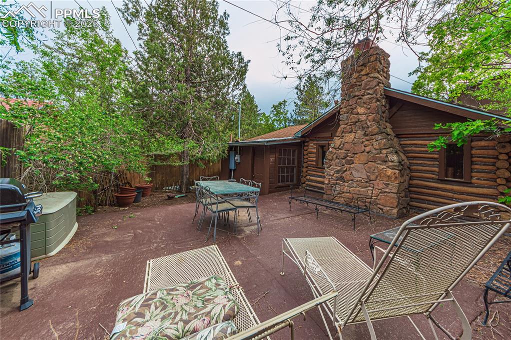 View of patio with grilling area and outdoor dining space