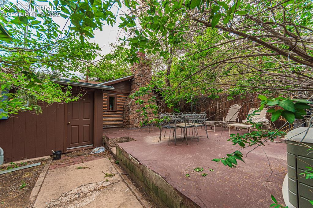 View of patio with outdoor dining area