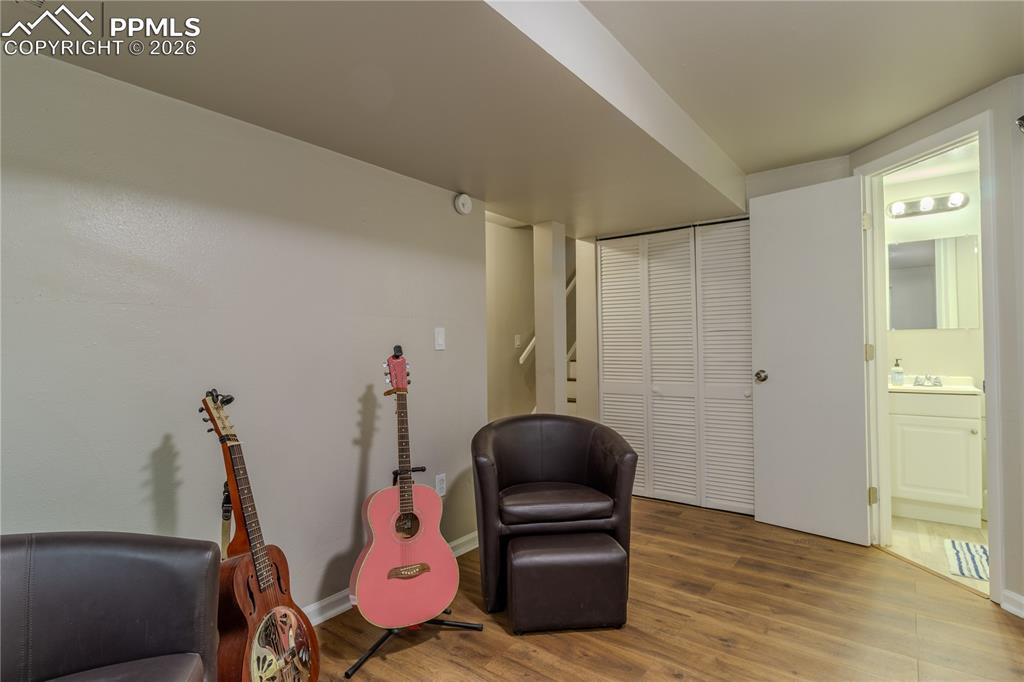 Basement sitting/playroom with lots of extra storage